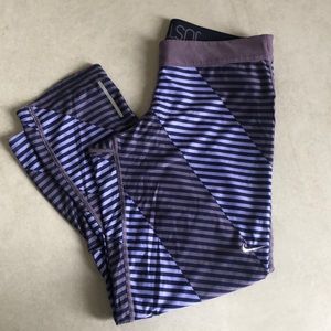 Nike Women’s Dri-Fit 3/4 length purple tights